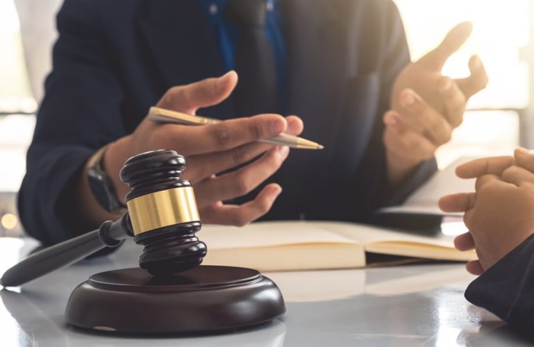 Business lawyer working about legal legislation in courtroom to help their customer